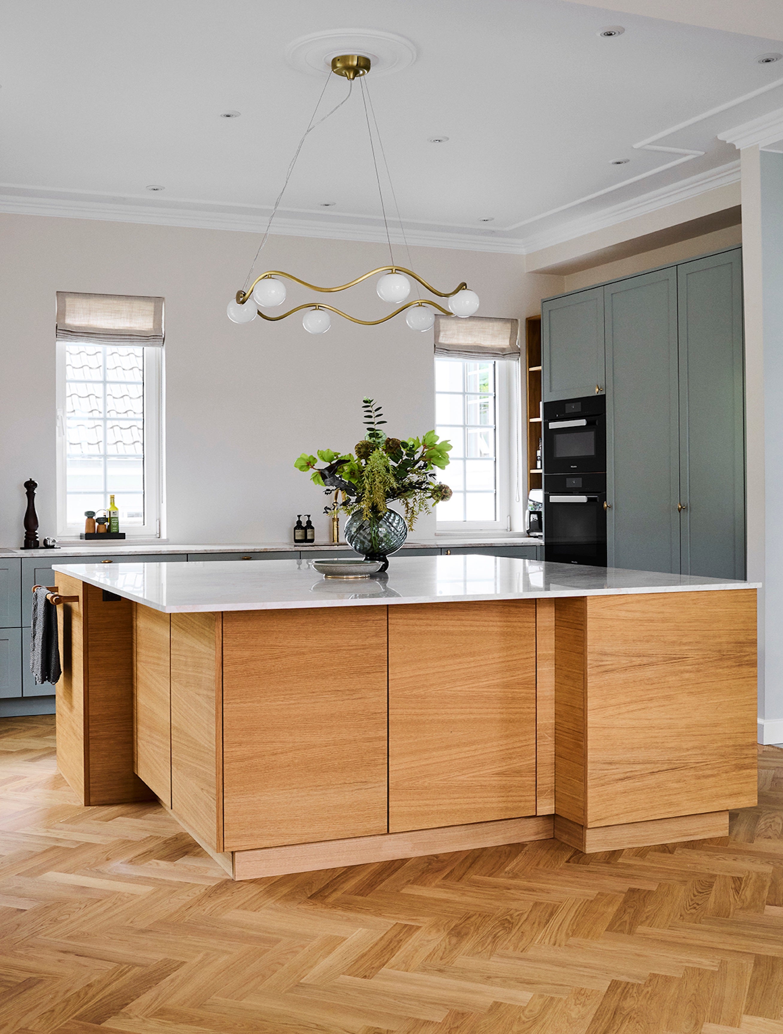 Modern kitchen with wooden island and white countertops