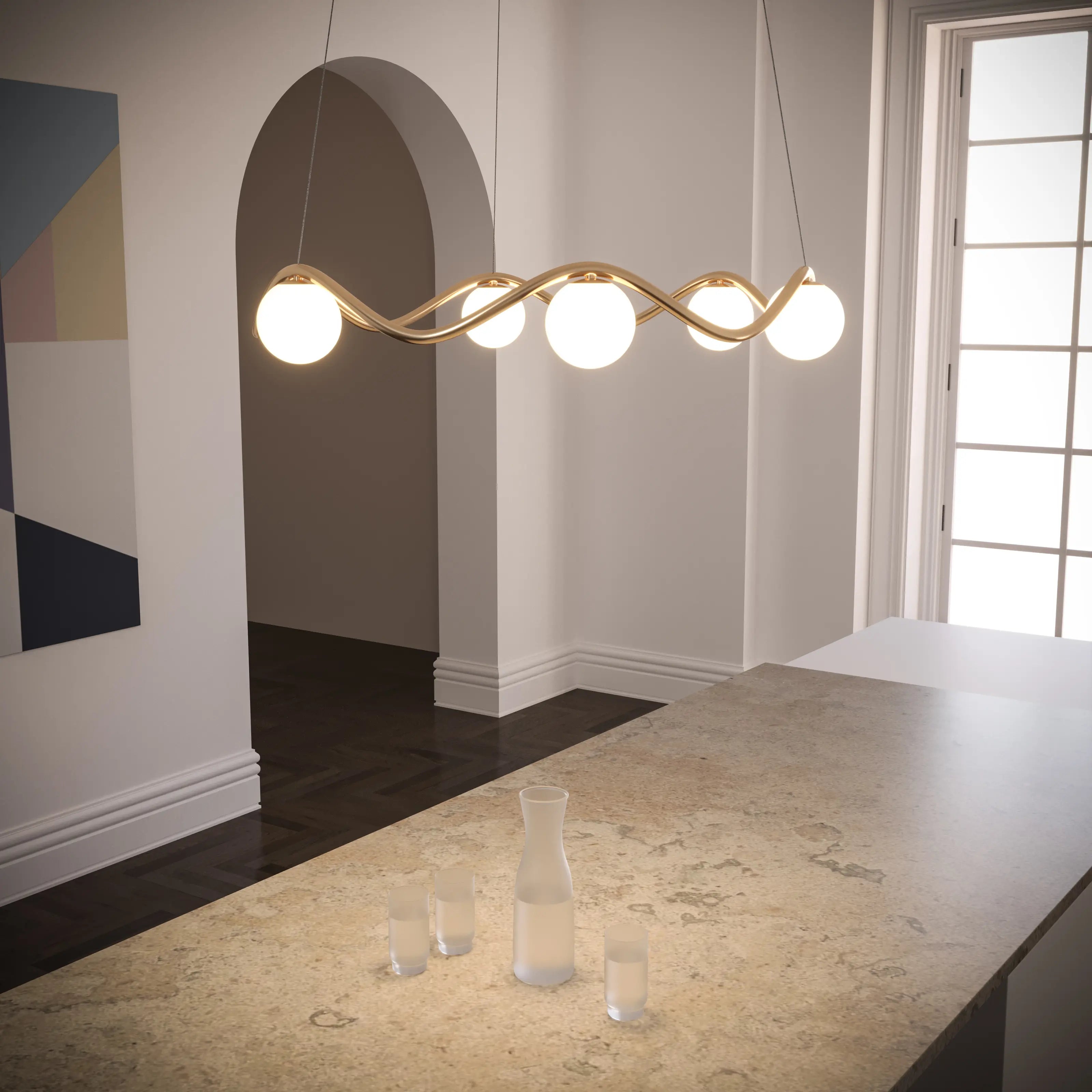 Modern chandelier hanging above a marble countertop in a stylish room.