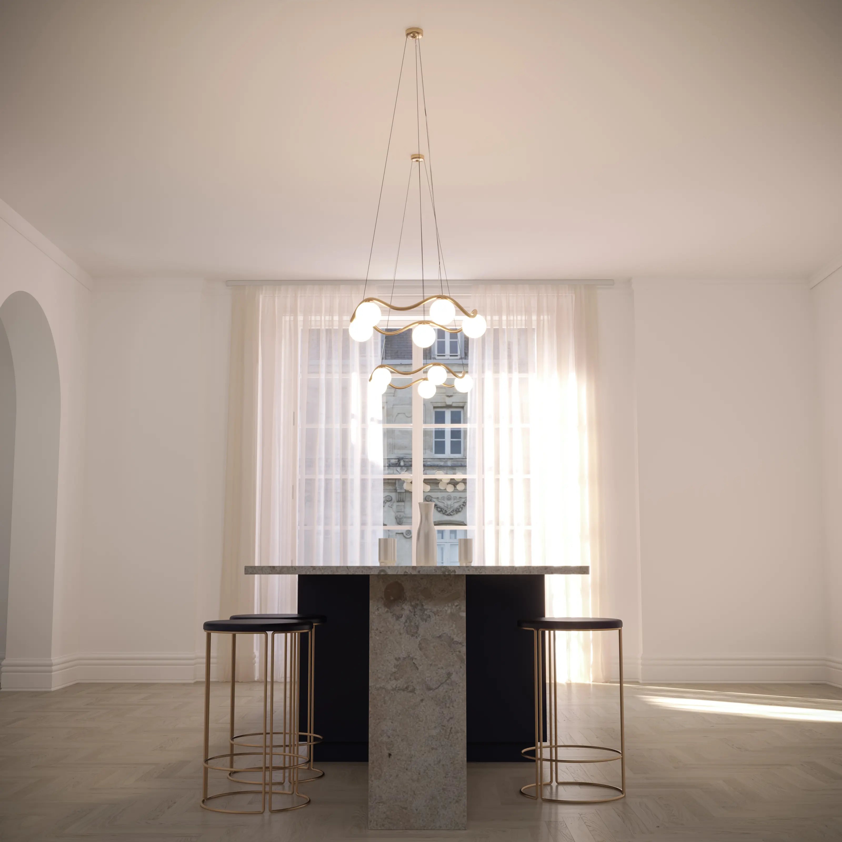 Modern kitchen island with stools and pendant light in a bright room