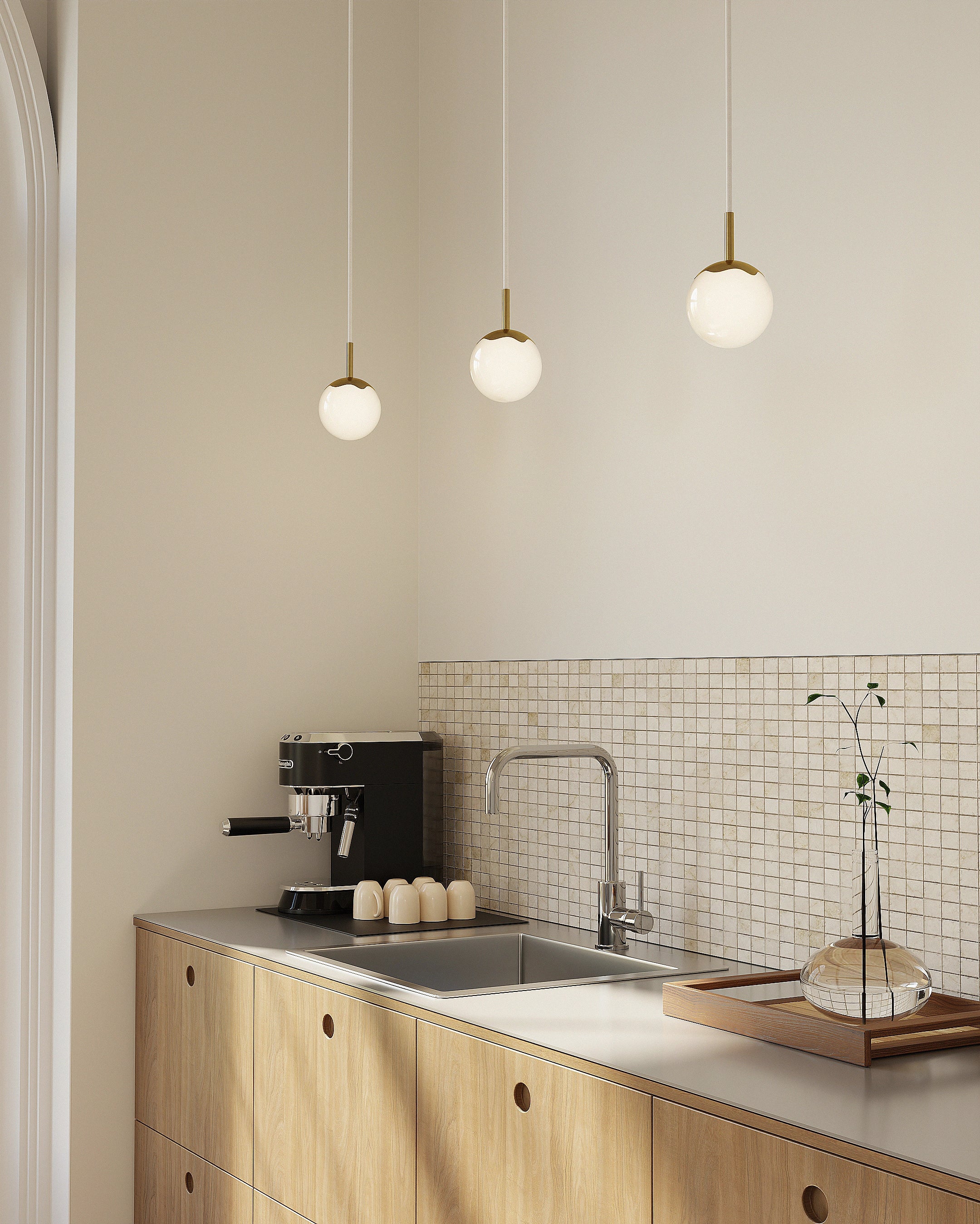 Modern kitchen with wooden cabinets, a sink, and a coffee machine.