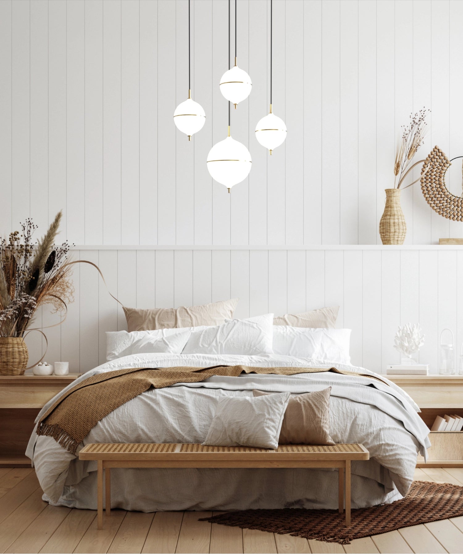 Modern bedroom with a bed, wooden bench, and decorative elements.