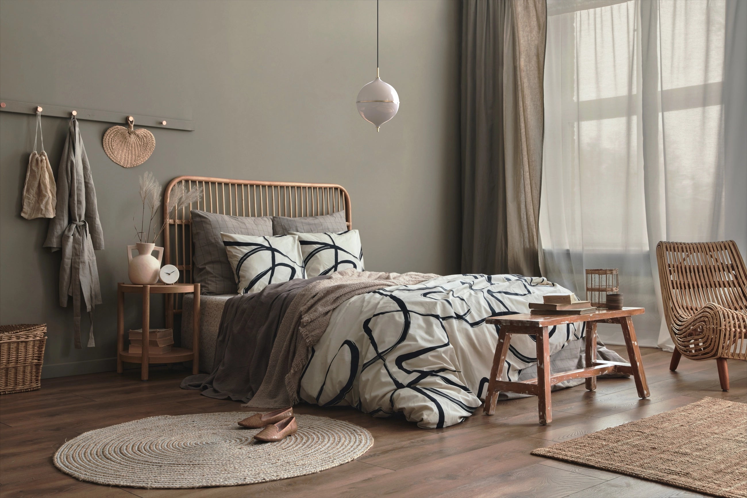 Cozy bedroom with wooden bed, side table, and chair.