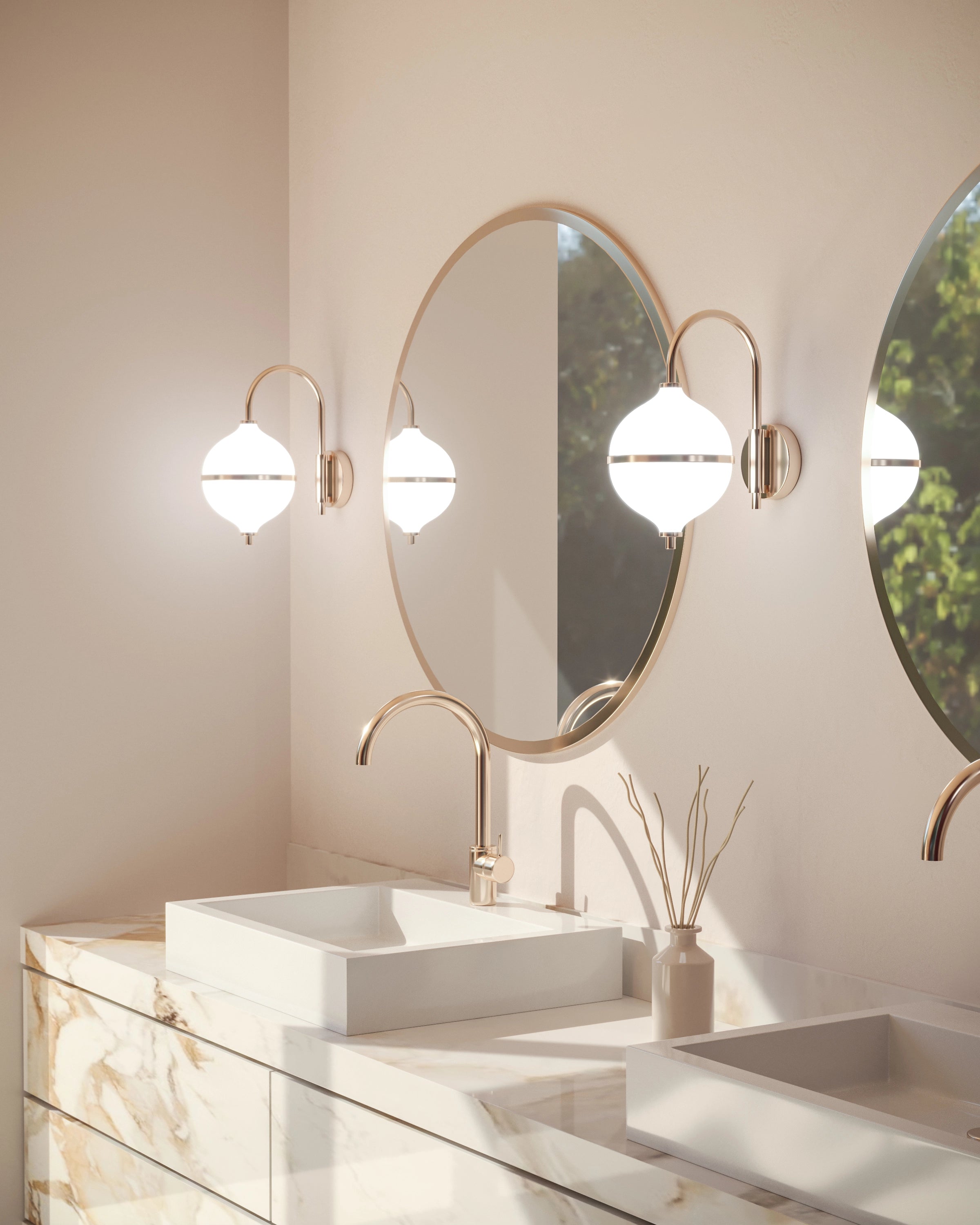 Bathroom vanity with marble countertop, round mirror, and wall lights.