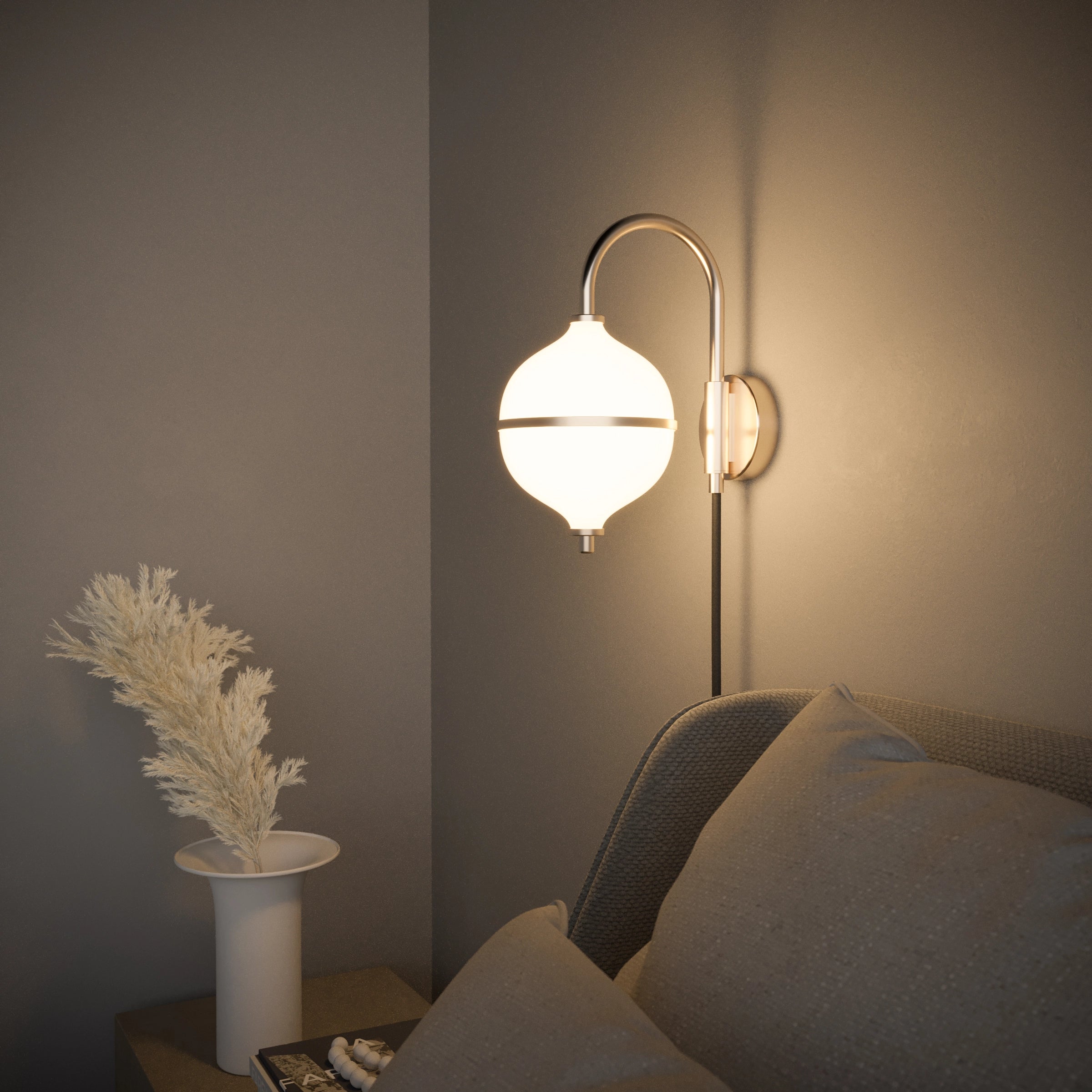 Wall-mounted lamp with a soft glow in a dimly lit room.