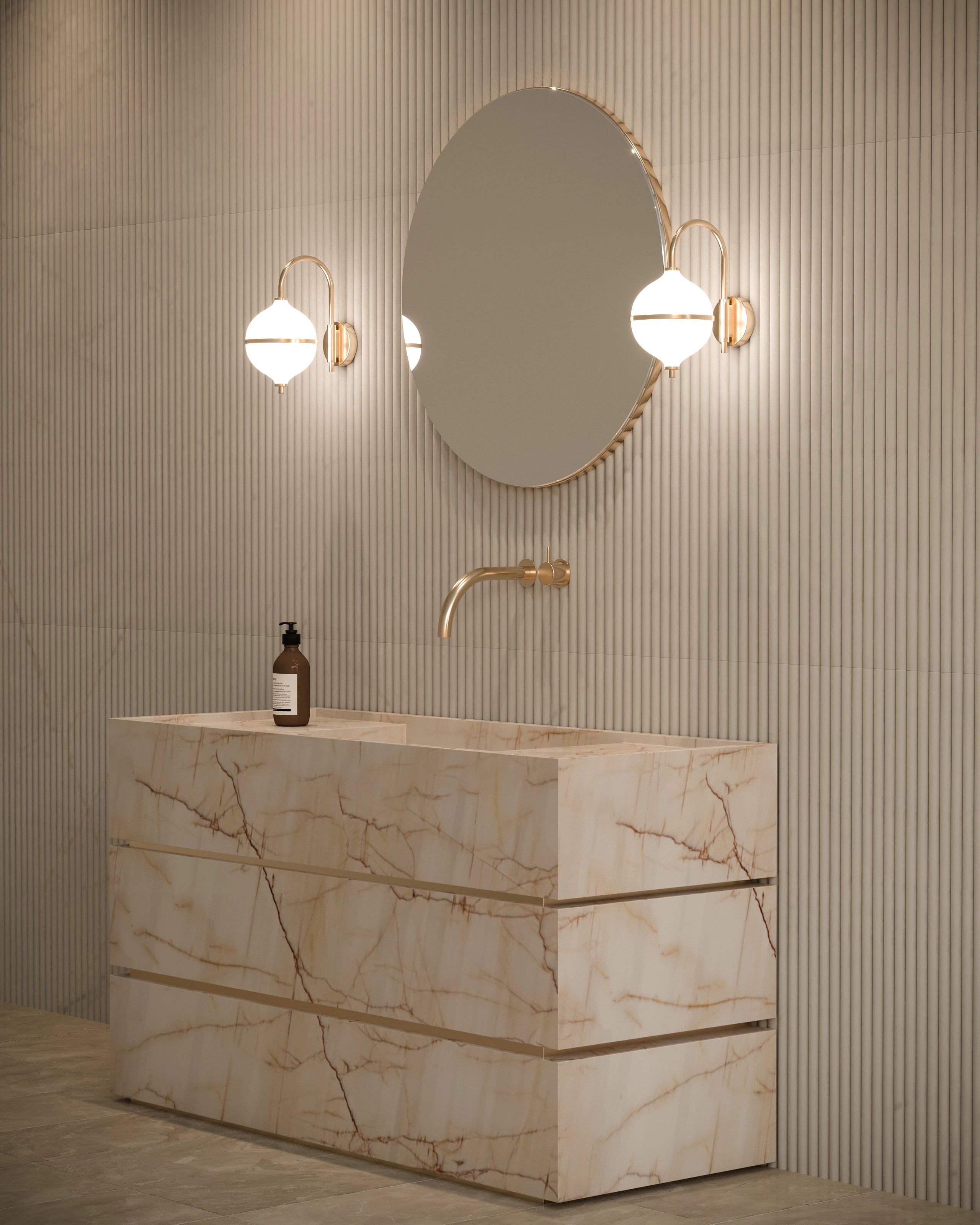 Marble bathroom vanity with round mirror, lights, and bottle against a striped wall.